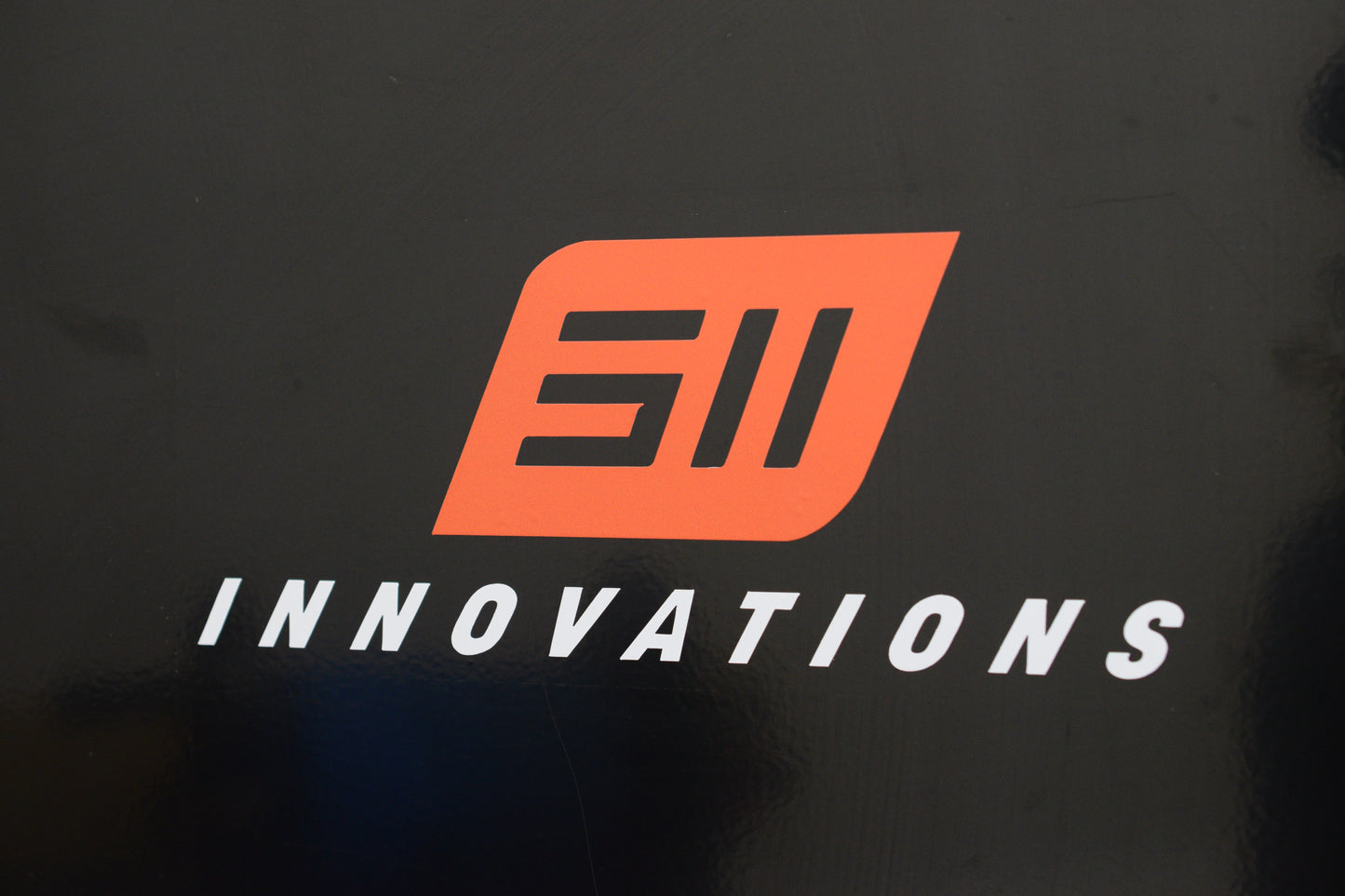 White and Orange Transfer 511 Innovations Sticker